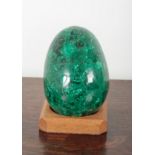 A LARGE CARVED MALACHITE EGG