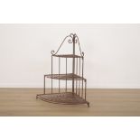 A WROUGHT IRON THREE TIER JARDINIERE STAND