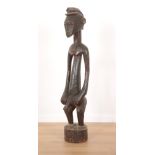 AN AFRICAN CARVED WOOD FIGURE