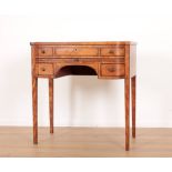 A GEORGE III SATINWOOD BOWFRONT WRITING DESK