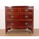 A GEORGE III MAHOGANY AND SATINWOOD CROSSBANDED BOW FRONT CHEST OF DRAWERS