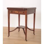 AN EDWARDIAN ROSEWOOD AND MARQUETRY ENVELOPE CARD TABLE