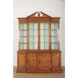 A GEORGE II STYLE PINE BREAKFRONT BOOKCASE IN THE MANNER OF WILLIAM KENT