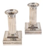 A PAIR OF VICTORIAN SILVER PLATED CANDLESTICKS