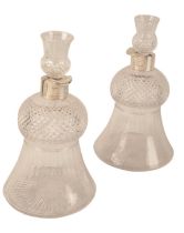 A PAIR OF LATE VICTORIAN SILVER MOUNTED THISTLE FORM WHISKY DECANTERS
