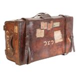 A VICTORIAN BROWN LEATHER TRAVELLING TRUNK