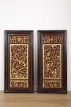 A PAIR OF CHINESE CARVED AND GILTWOOD PANEL GROUPS