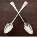 A PAIR OF GEORGE III SILVER OLD ENGLISH PATTERN SERVING SPOONS