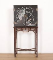 A JAPANESE BLACK LACQUERED CABINET