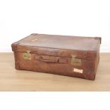 AN EDWARDIAN BROWN LEATHER SUITCASE