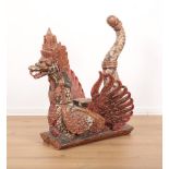 A SOUTH EAST ASIAN CARVED AND POLYCHROME PAINTED DRAGON