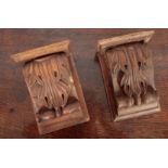 A PAIR OF CARVED OAK CORBELS