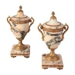 A PAIR OF NEOCLASSICAL PINK AND GREY MARBLE AND GILT METAL MOUNTED URNS