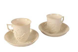 A PAIR OF BLANC DE CHINE PORCELAIN CUPS AND SAUCERS