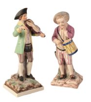 A GERMAN FAIENCE FIGURE OF A DRUMMER BOY