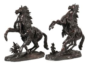 AFTER GUILLAUME I COUSTOU (1677-1746) A PAIR OF BRONZE MARLEY HORSES