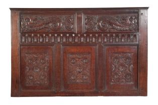 A SECTION OF 17TH CENTURY CARVED OAK PANELLING