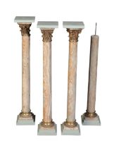 A SET OF FOUR EGYPTIAN STRIATED ALABASTER AND GILT BRONZE MOUNTED COLUMNAR PEDESTALS