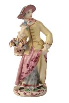 A BOW PORCELAIN FIGURE OF A LADY WITH FLOWERS