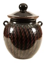 A LARGE STUDIO POTTERY JAR AND COVER