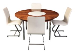 RICHARD YOUNG FOR MERROW ASSOCIATES: A ROSEWOOD DINING TABLE WITH CENTRAL LAZY SUSAN AND SET OF FOUR
