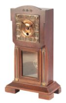 A MAHOGANY CASED ARTS AND CRAFTS STYLE MANTEL CLOCK