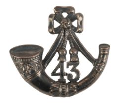 A SILVER GILT 43RD FOOT OFFICERS CAP BADGE