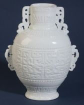 A CHINESE WHITE GLAZED VASE