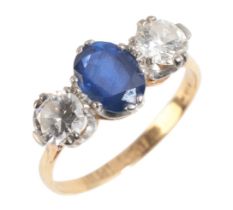AN 18CT GOLD THREE STONE SAPPHIRE AND DIAMOND RING