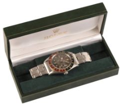 ROLEX GMT MASTER OYSTER PERPETUAL "PUSSY GALORE": A GENTLEMAN'S STAINLESS STEEL BRACELET WATCH