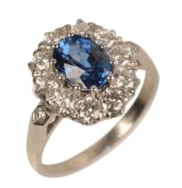 A PLATINUM SAPPHIRE AND DIAMOND CLUSTER RING