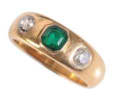 A GOLD EMERALD AND DIAMOND GYPSY RING