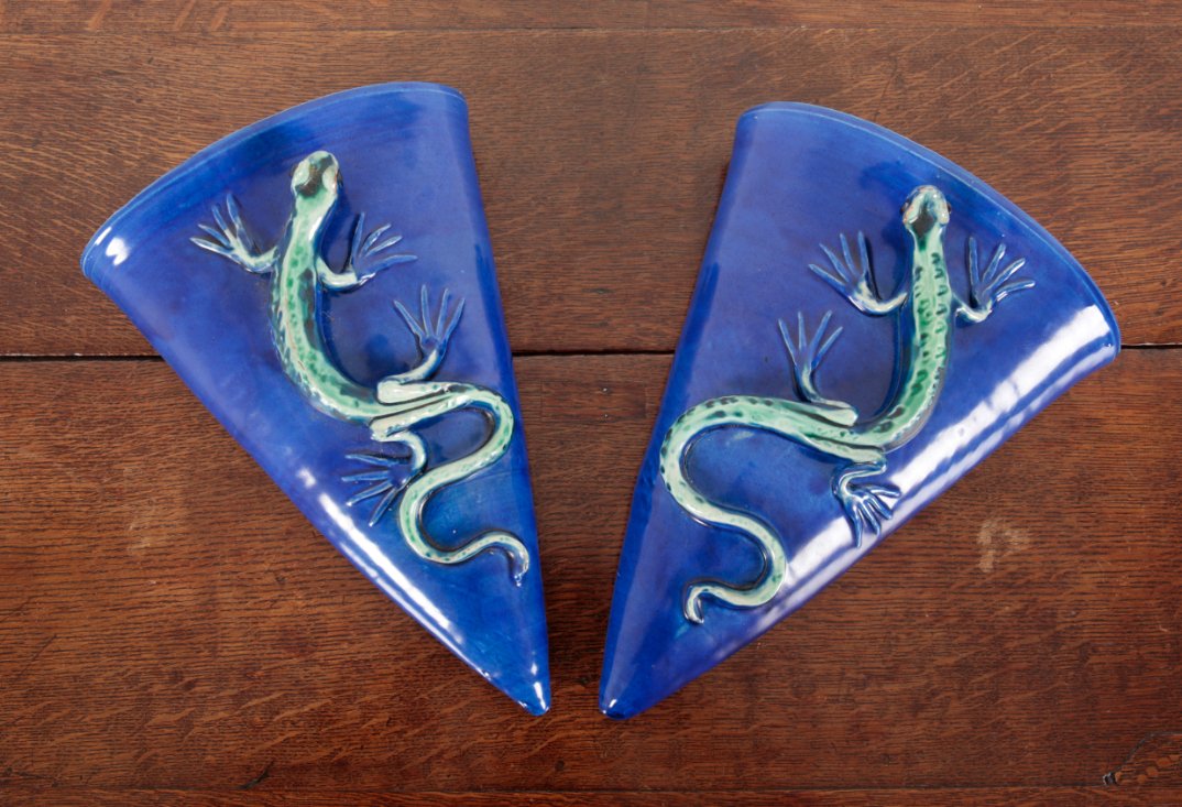 A PAIR OF BARON BARNSTAPLE POTTERY TRIANGULAR WALL POCKETS