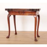 A GEORGE II FIGURED WALNUT CARD TABLE