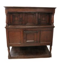 A MID 17TH CENTURY JOINED OAK LIVERY CUPBOARD