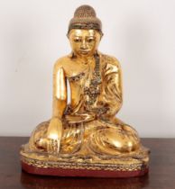 A BURMESE GILT-LACQUERED SEATED BUDDHA