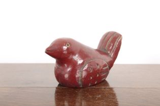 A CHINESE RED PAINTED WOODEN BIRD FIGURE
