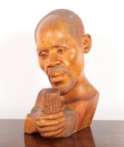BARNABUS NDUDZO (1945-2012) A CARVED BUST OF A MAN