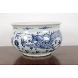 A CHINESE BLUE AND WHITE TRANSITIONAL STYLE 'DRAGON ' JARDNIERE