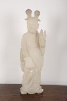A LARGE CHINESE CARVED SOAPSTONE FIGURE OF AN IMMORTAL