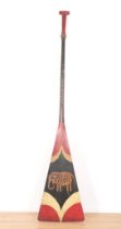 A LARGE SOUTH-EAST ASIAN PAINTED WOOD PADDLE