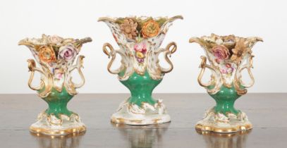 A GROUP OF THREE COALPORT FLORAL ENCRUSTED PORCELAIN URNS