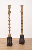 A PAIR OF LARGE AND UNUSUAL NEAR EASTERN BRASS PRICKET CANDLESTICKS