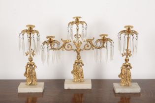 A GILT METAL FIGURAL CANDELABRA