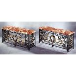 AN IMPORTANT PAIR OF REGENCE WROUGHT IRON AND GILT CONSOLE TABLES