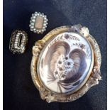 A VICTORIAN MOURNING BROOCH WITH ELABORATE HAIR ARRANGEMENT