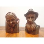 A PAIR OF NORTH EUROPEAN CARVED AND STAINED WOOD BUSTS
