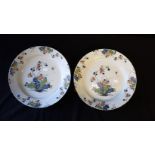 A PAIR OF 18TH CENTURY POLYCHROME DELFTWARE CHARGERS