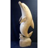 A CARVED WOOD DOLPHIN SCULPTURE