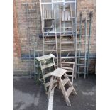 A COLLECTION OF VINTAGE WOODEN STEPLADDERS